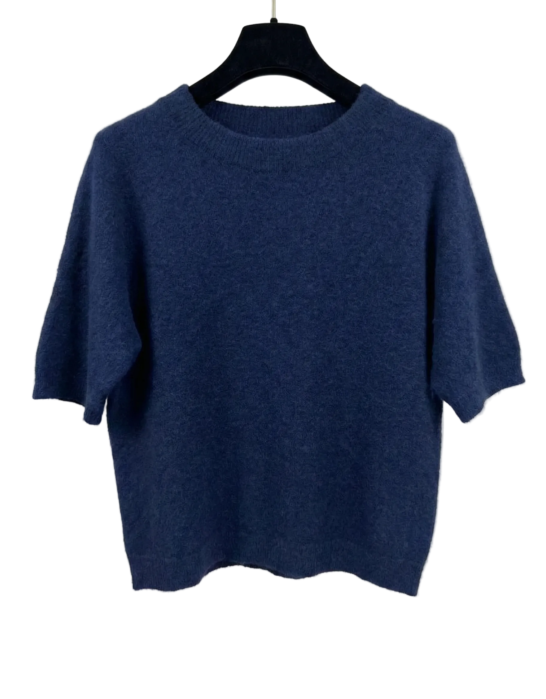 Blue sweater on a hanger against a white background