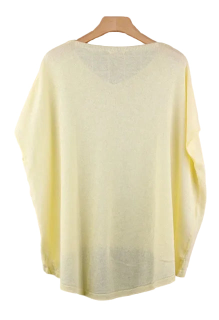 Light yellow top on a wooden hanger