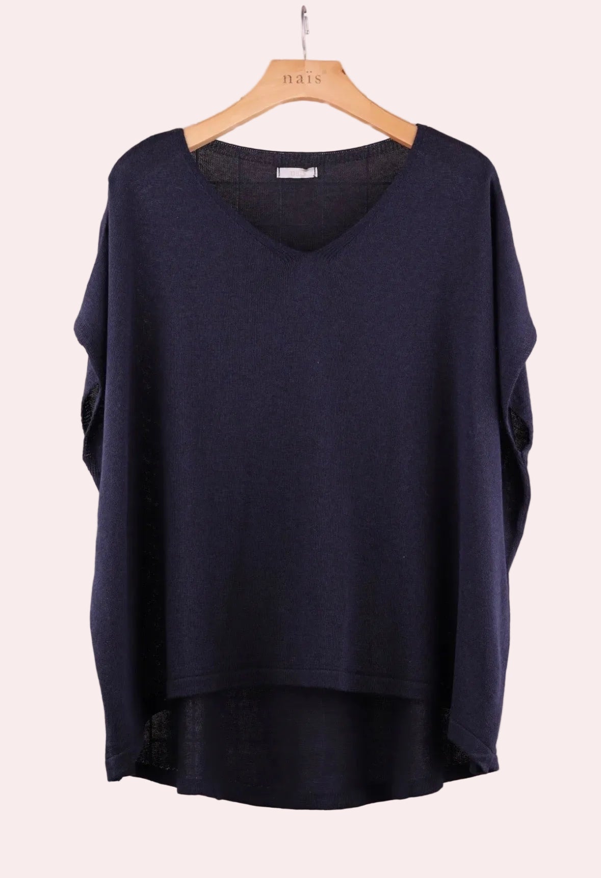 Navy blue sweater on a wooden hanger