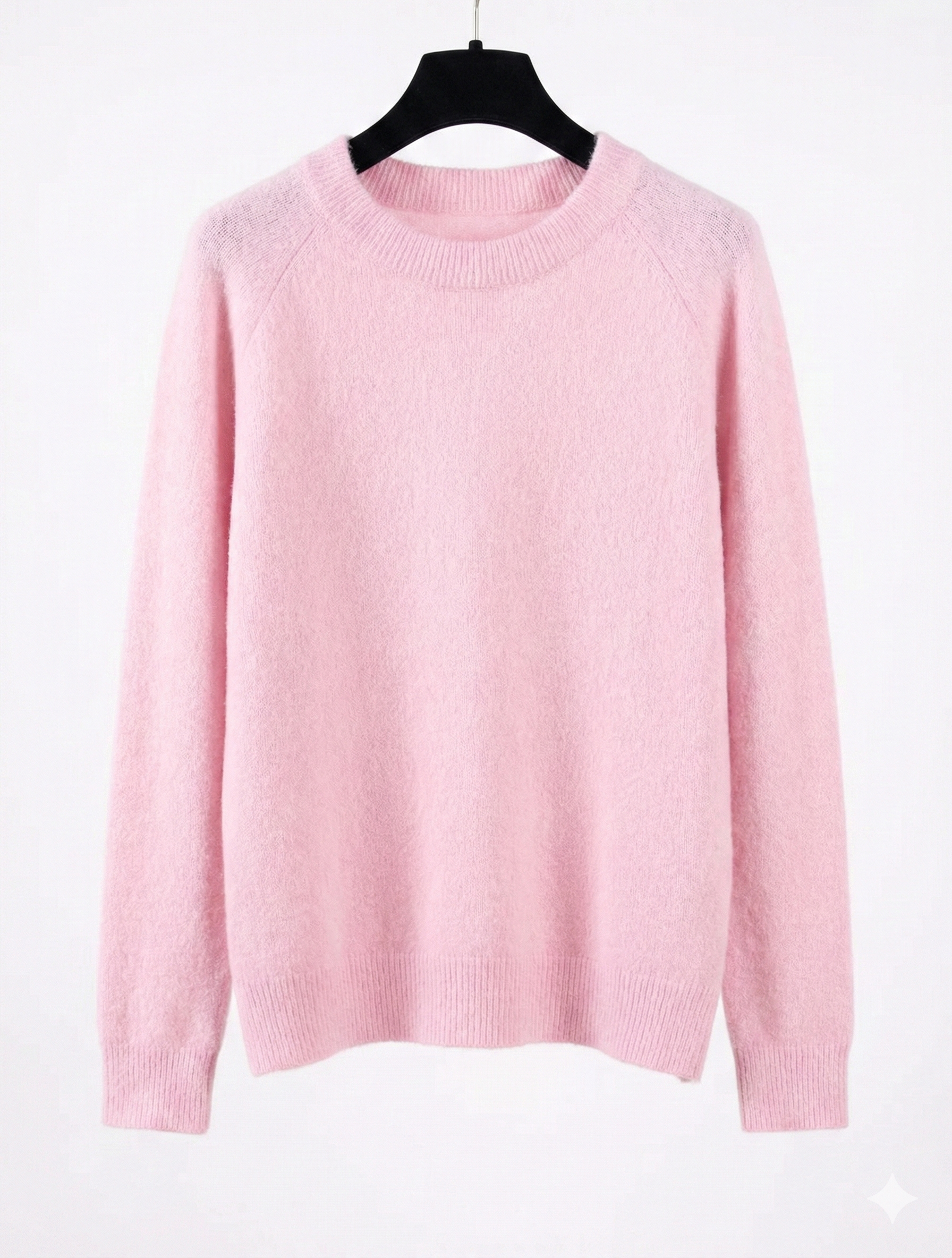 Pink sweater on a hanger against a white background