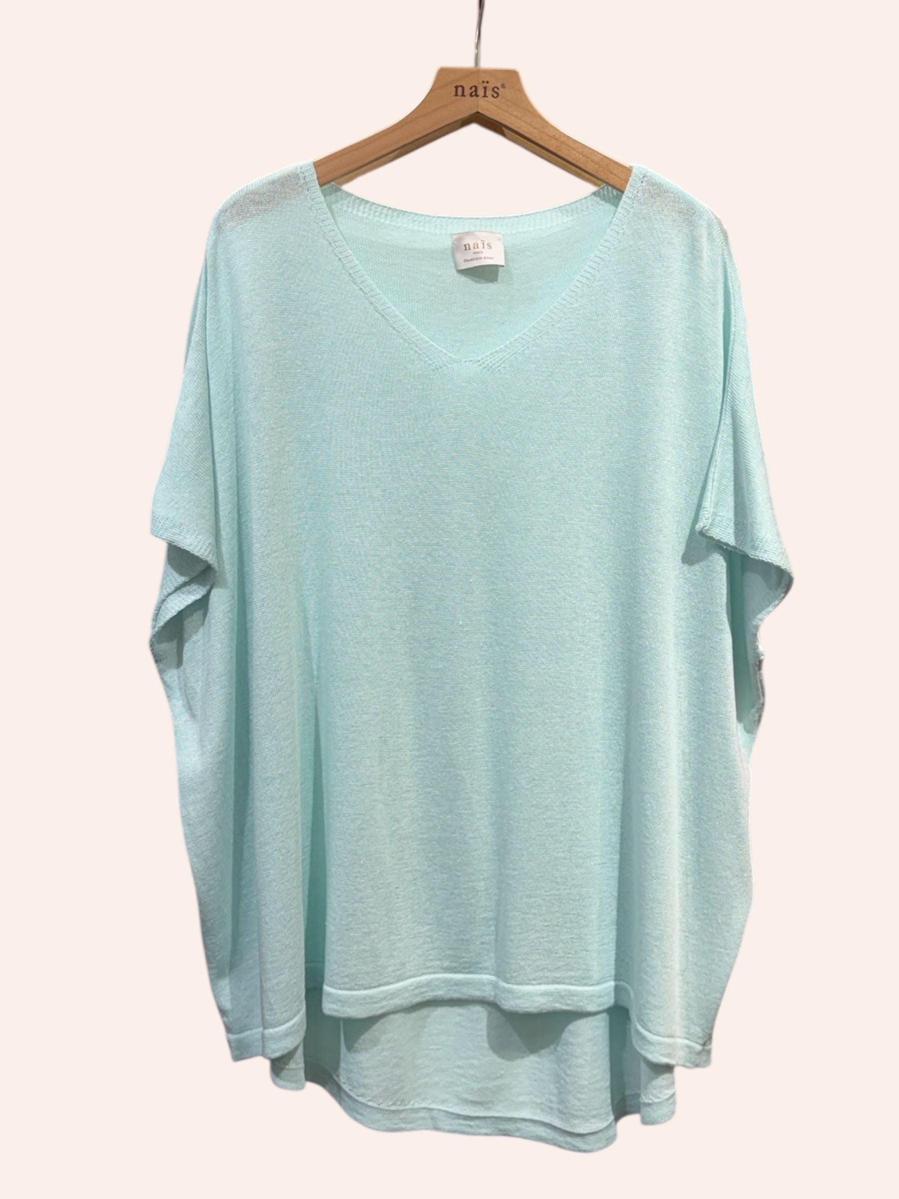 vert d'eau sweater on a hanger