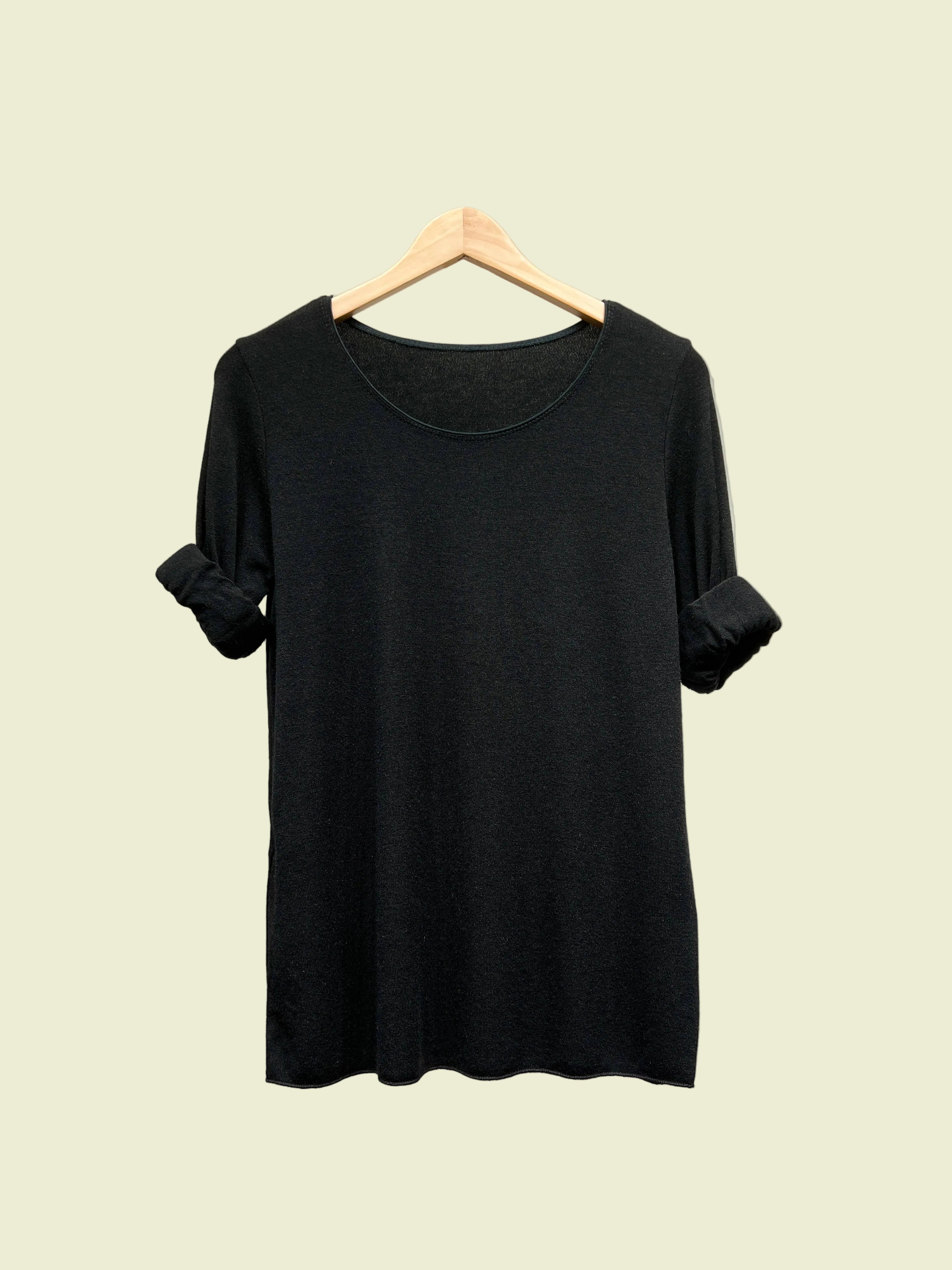 Black top with round neck and long sleeves