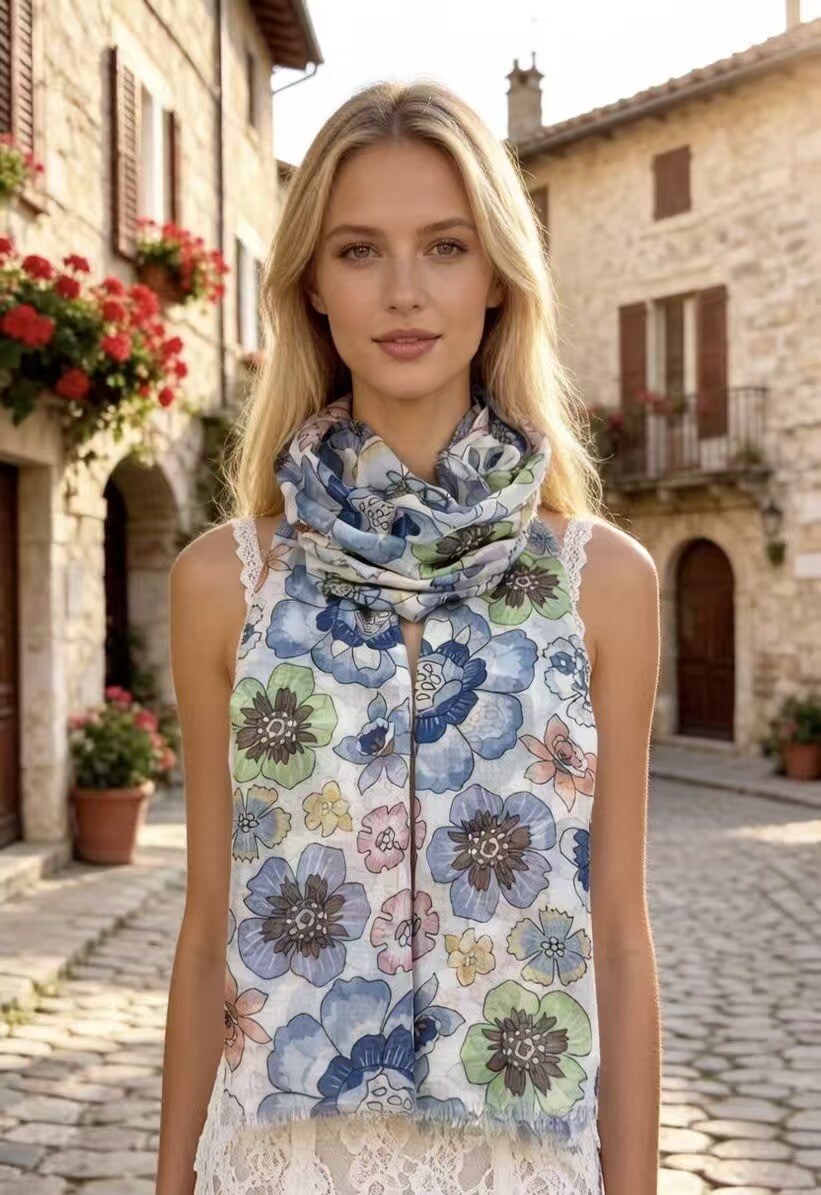 Woman wearing a floral scarf in an Italian village setting