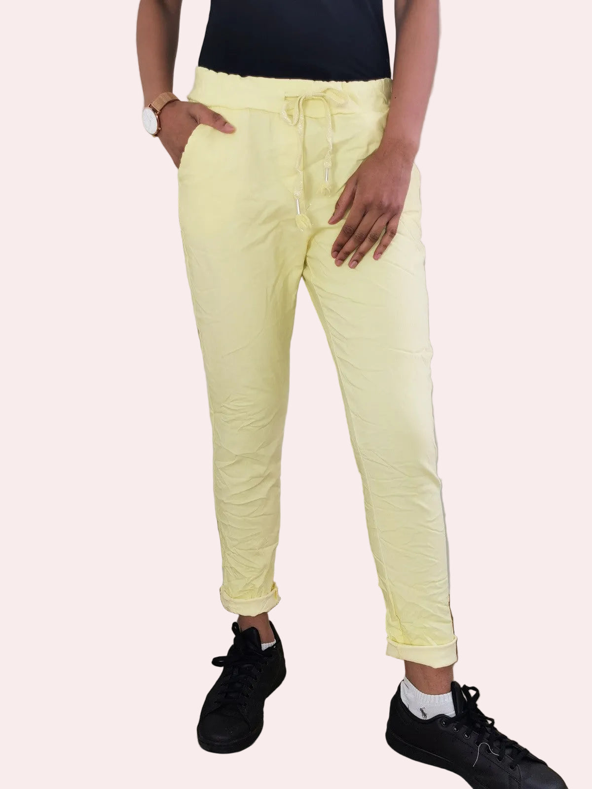 Person wearing light yellow pants