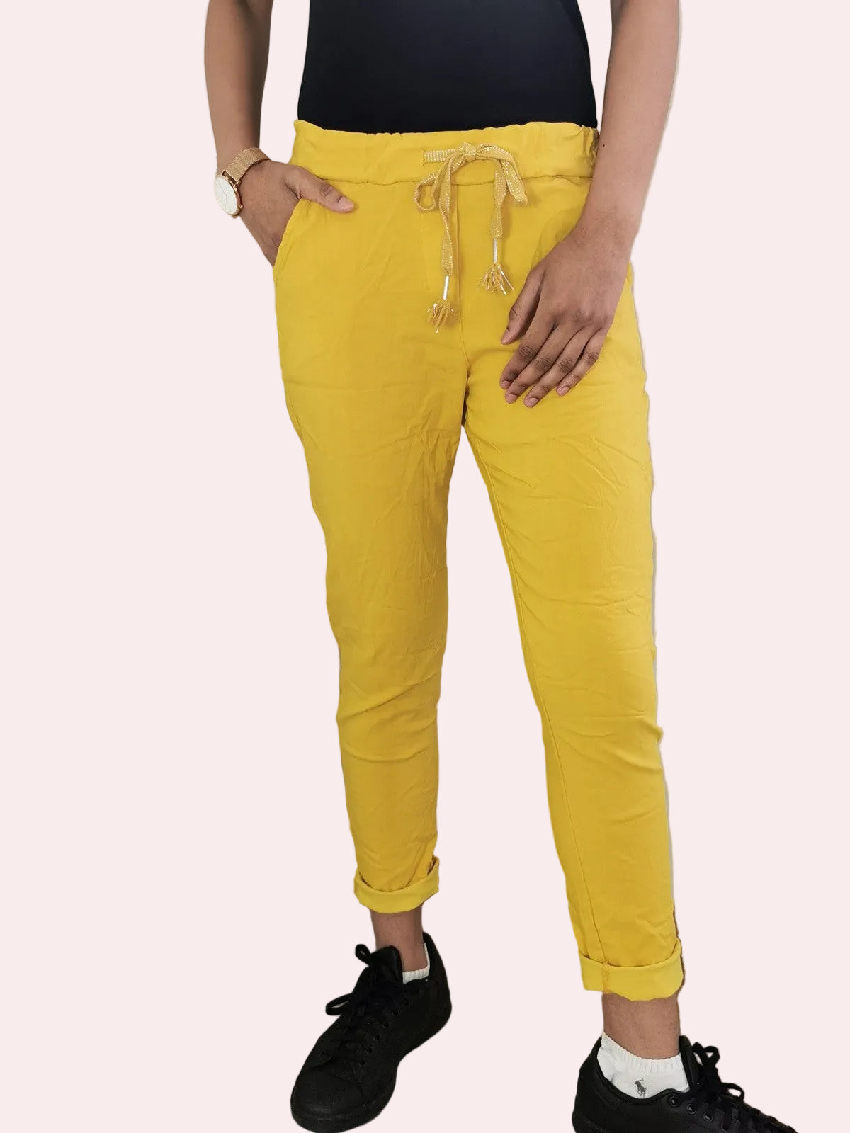 Person wearing yellow pants