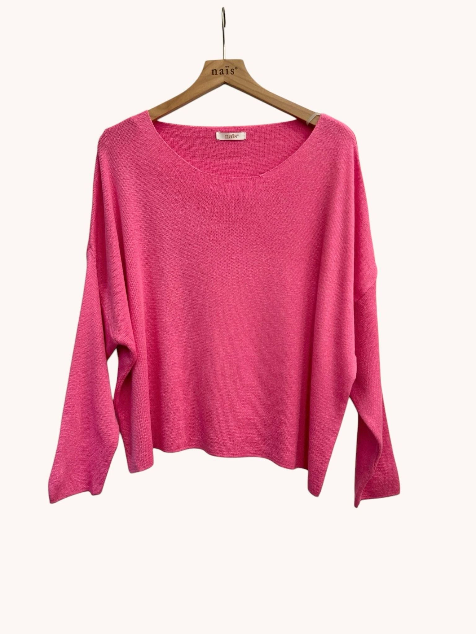 Pink sweater on a wooden hanger