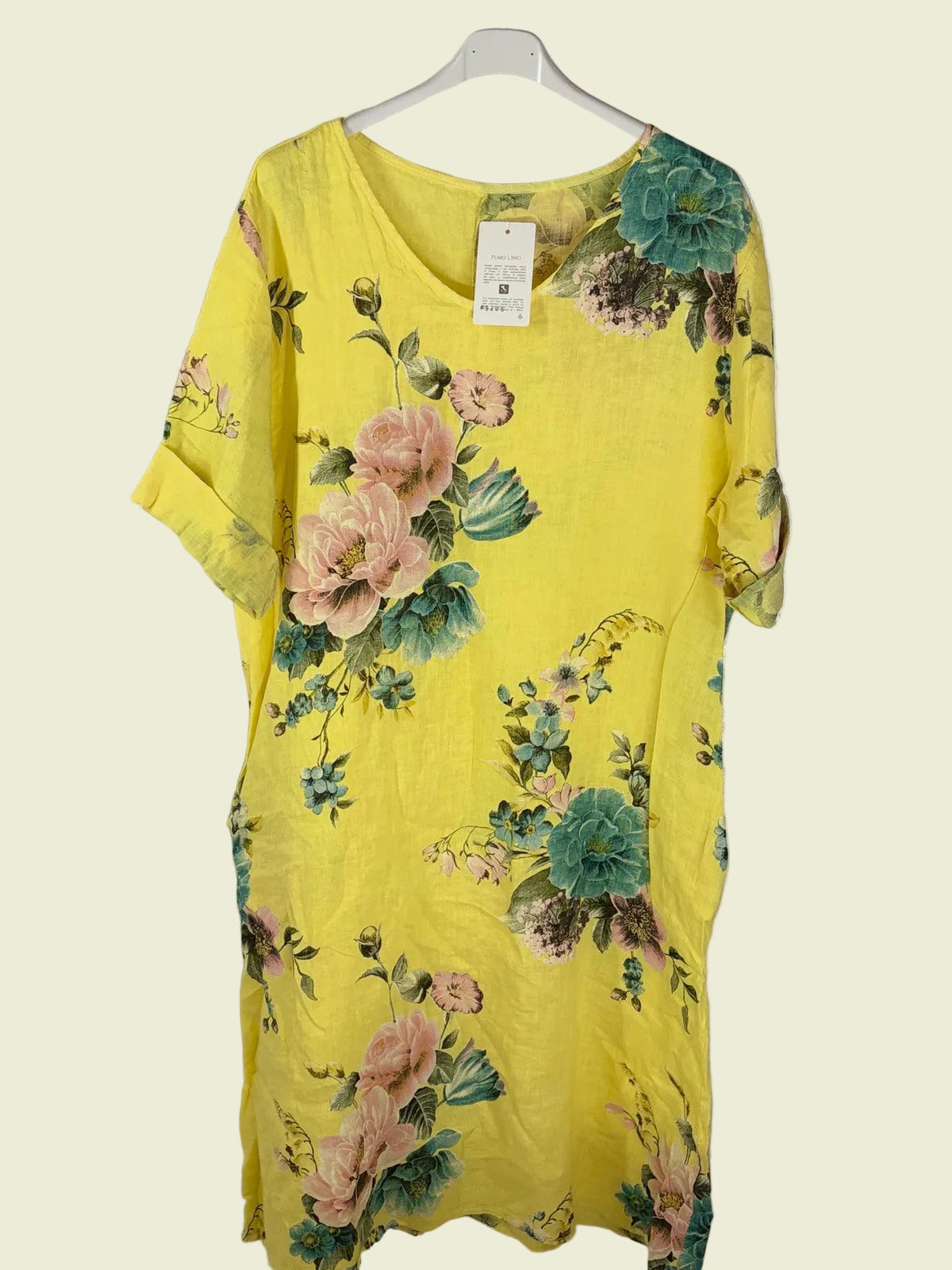 Yellow floral dress on a hanger