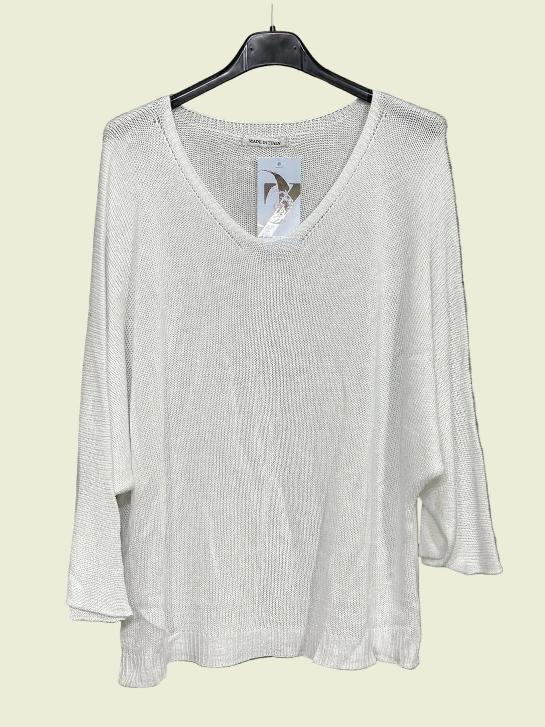 White sweater on a hanger