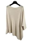 Beige sweater on a black hanger against a white background