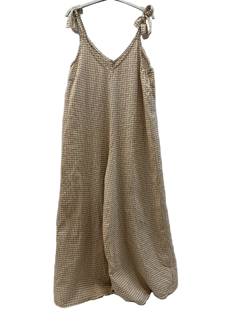 Beige checkered dress with bow straps on a white background