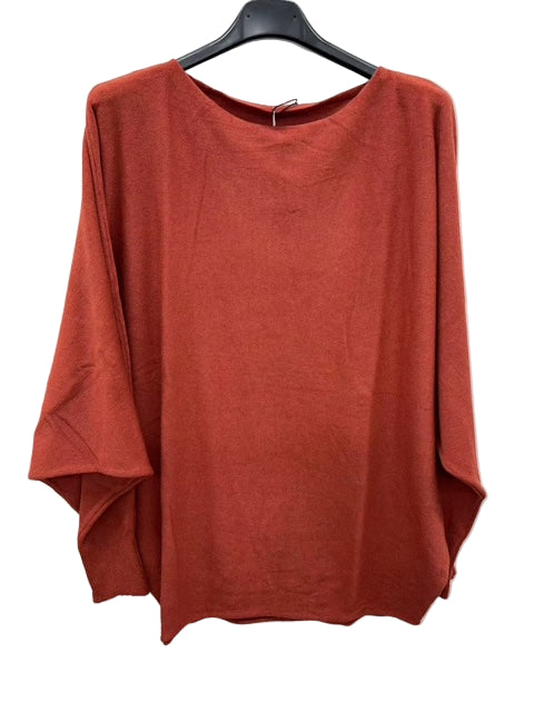 Brown sweater on a hanger against a white background