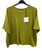 Green shirt on a hanger with a visible brand tag against a white background