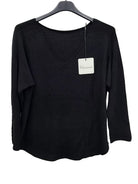 Black long-sleeve top on a hanger with a visible brand tag against a white background