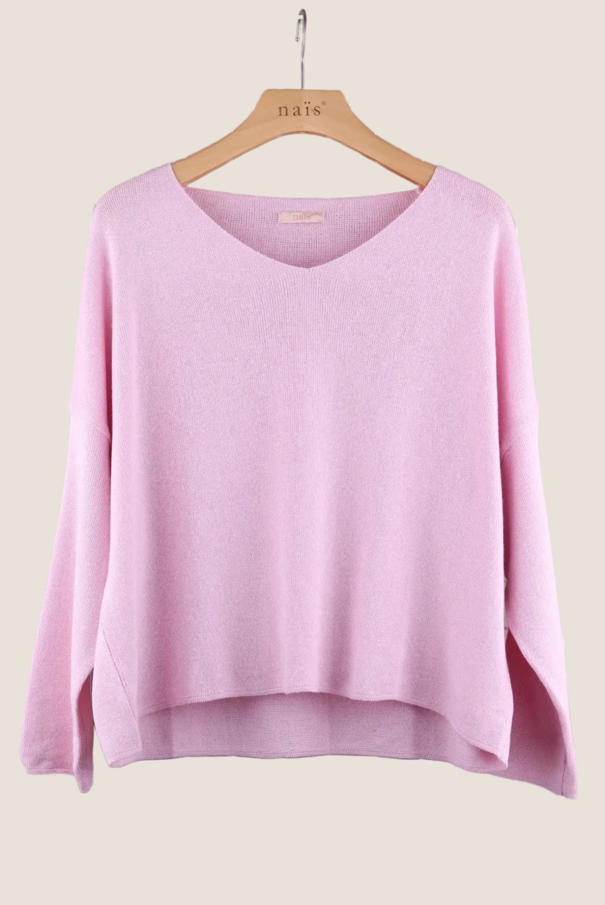 Pink sweater on a hanger