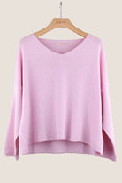 Pink sweater on a hanger