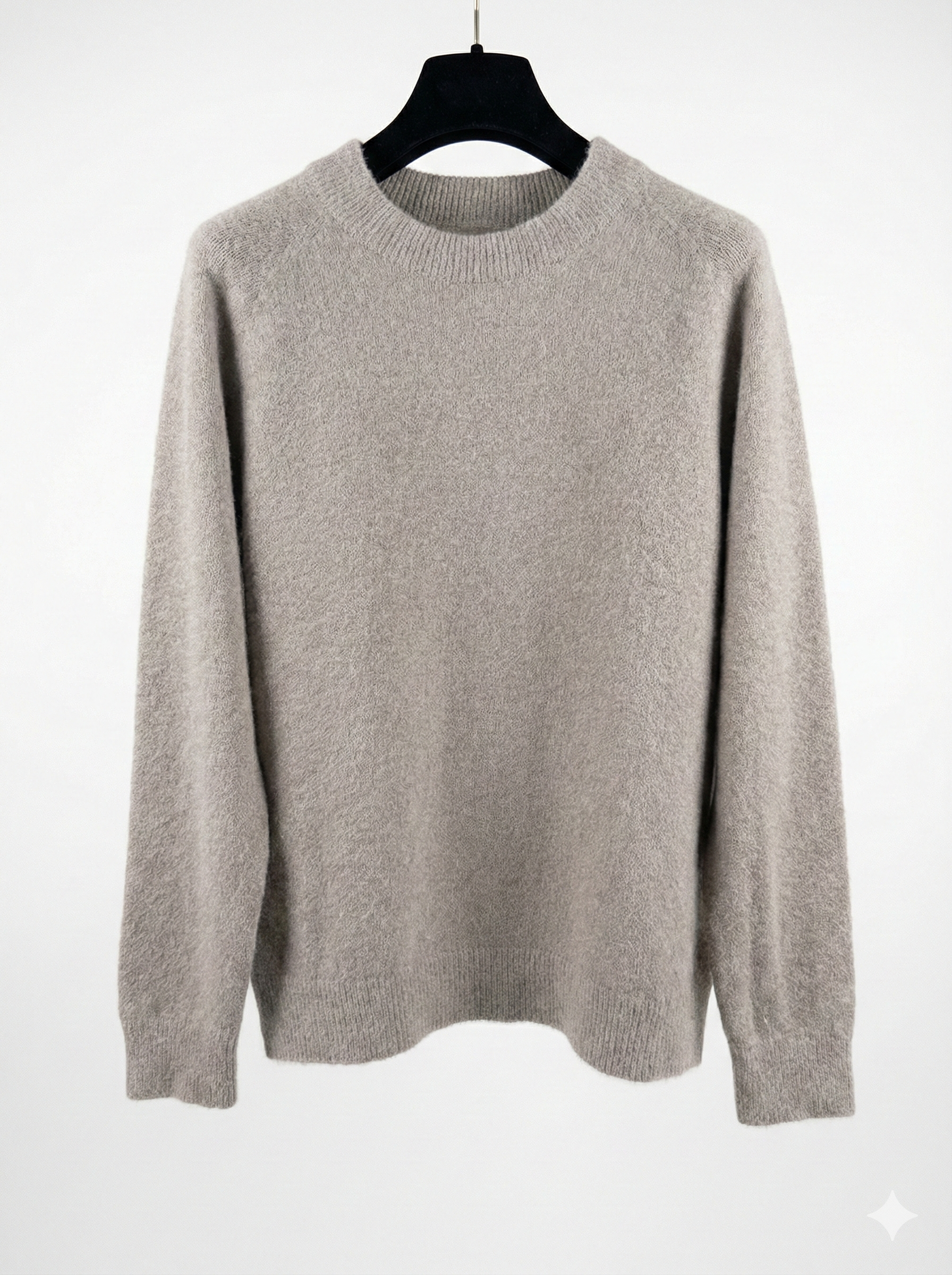 Taupe sweater on a hanger against a white background