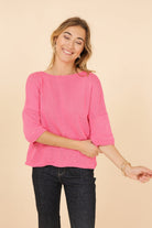 Woman wearing a pink sweater 