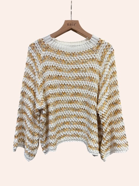 Striped sweater on a hanger against a plain background