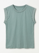 Sleeveless green shirt on a white background