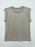 Beige sleeveless shirt on a white background