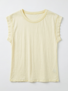 Light yellow sleeveless top on a light gray background