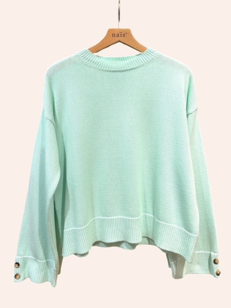 Vert d eau sweater on a hanger 