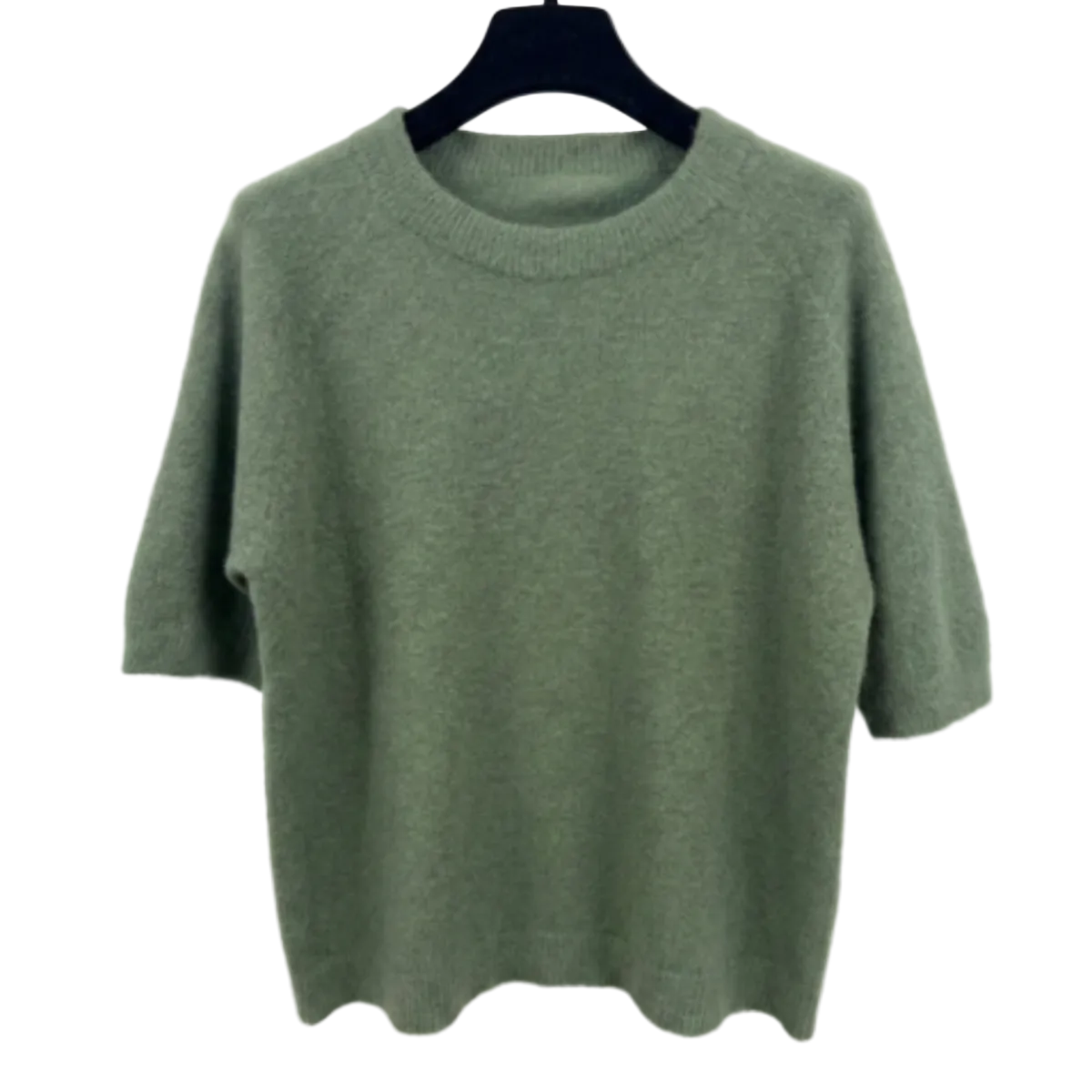 Green sweater on a hanger against a white background
