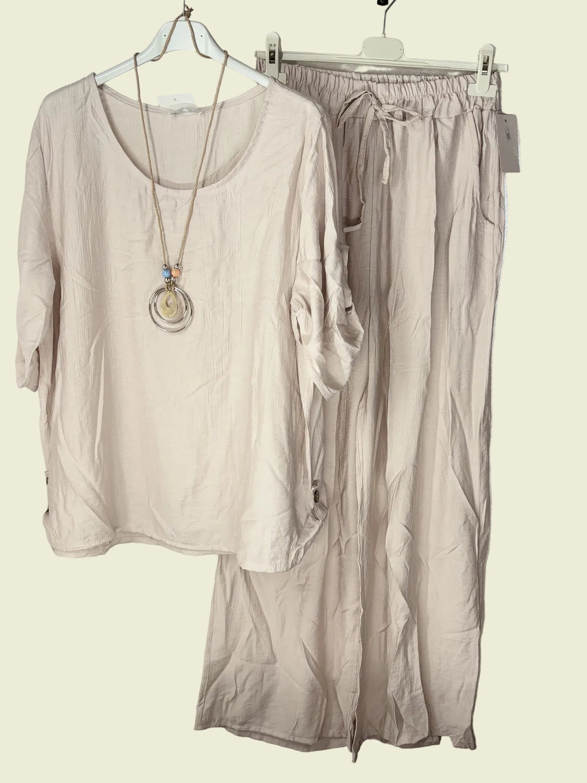 Beige outfit with a shirt and pants 