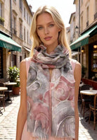 Woman wearing a patterned scarf in an urban setting