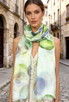 Woman wearing a colorful scarf in an urban setting
