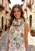 Woman wearing a floral scarf in an Italian street setting