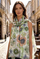 Woman wearing a floral scarf in an urban setting
