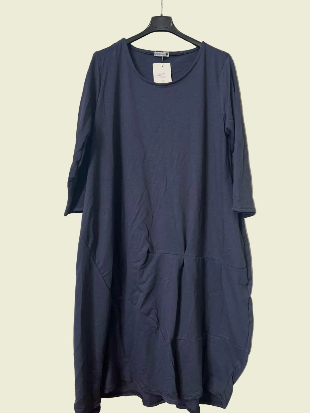 Navy blue dress on a hanger 