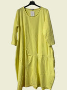 Yellow dress on a hanger 