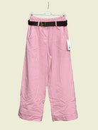 Pink pants with a black belt