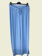 Light blue trousers on a hange