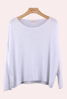 White sweater on a hanger