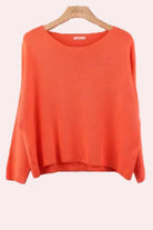Orange sweater with long sleeves