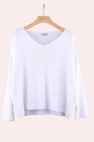 White long-sleeve sweater with v neck