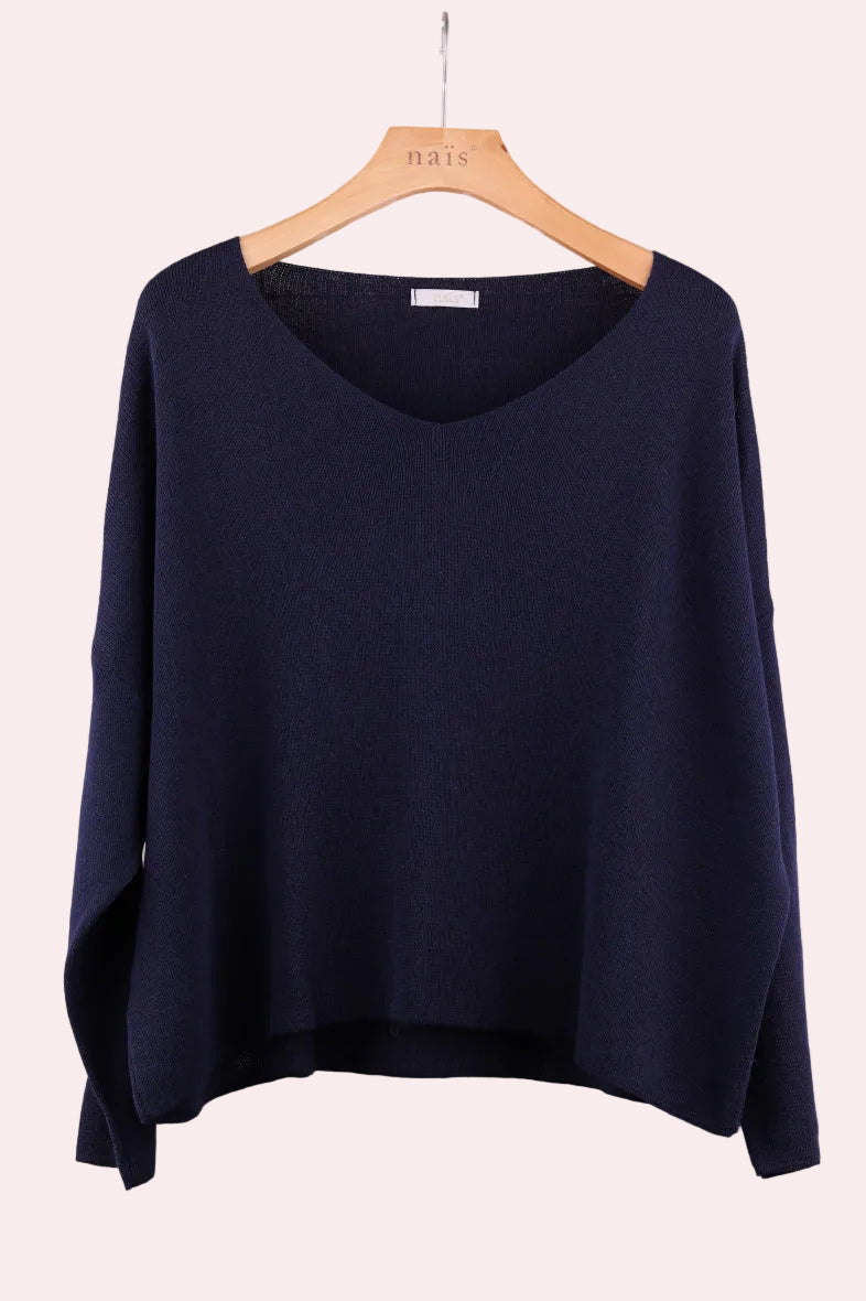 Navy blue sweater on a hanger