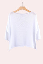 White shirt on a wooden hanger