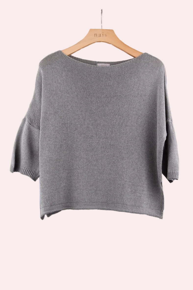 Khaki sweater on a wooden hanger