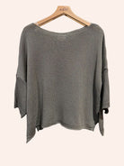 Taupe sweater on a hanger 