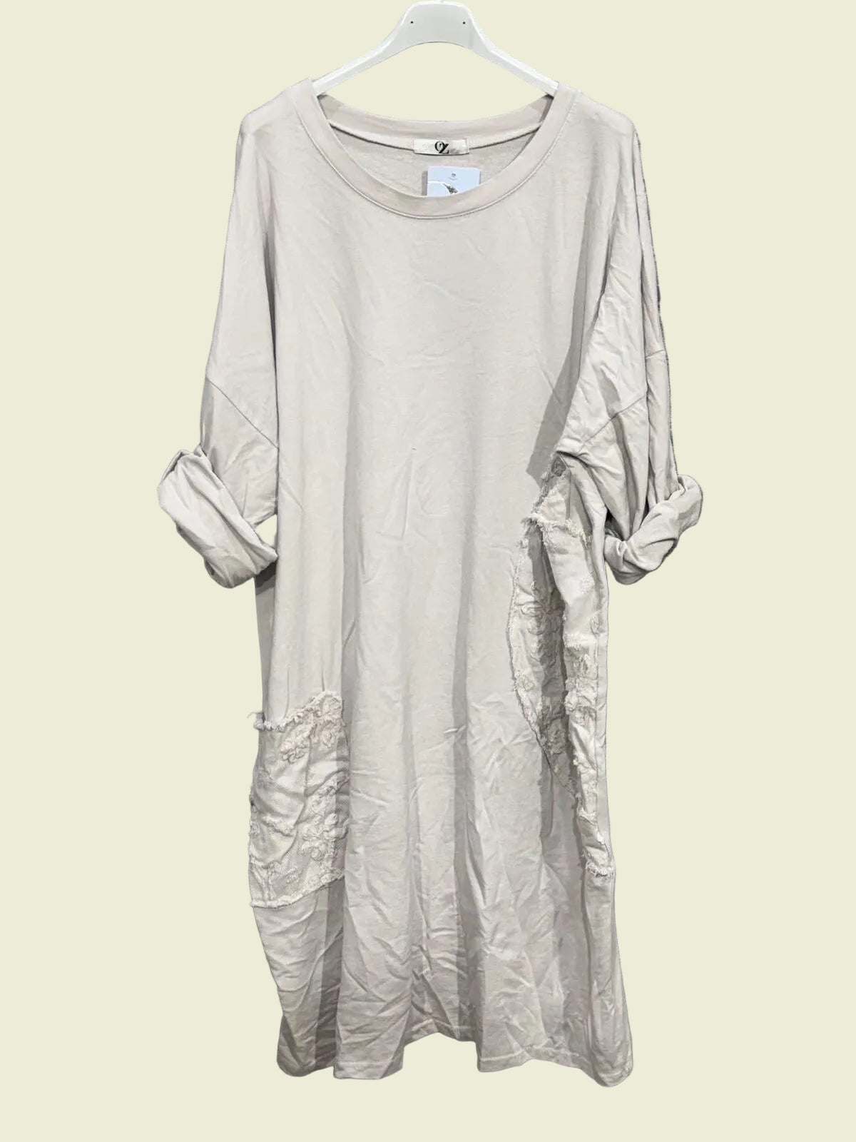 Ecru dress on a hanger 