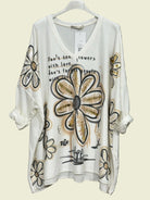 White top with floral designs 