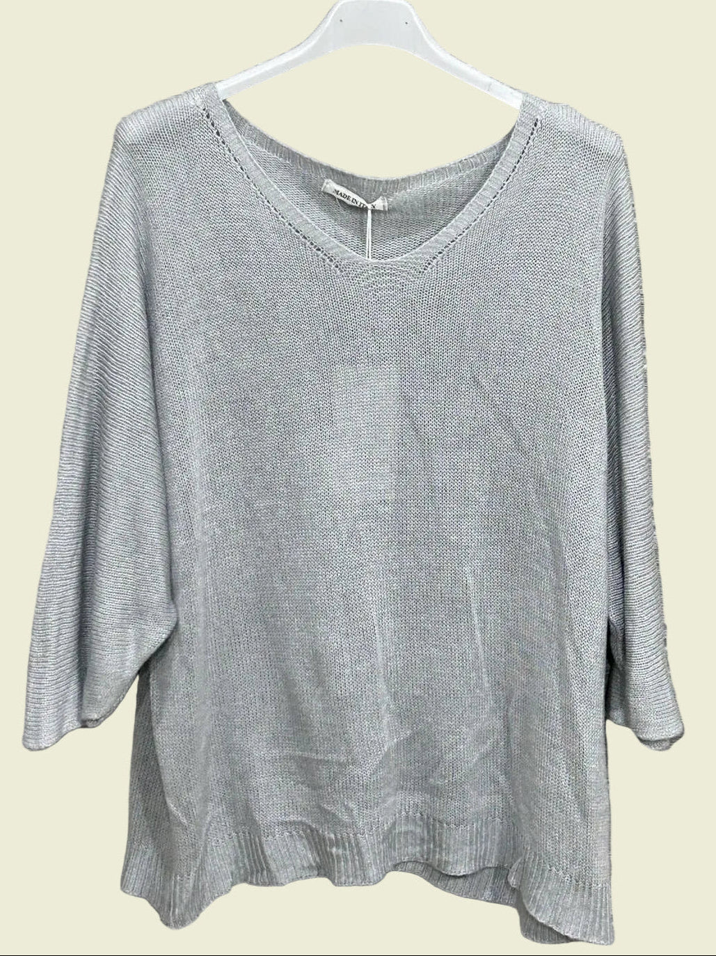 Gray sweater on a hanger