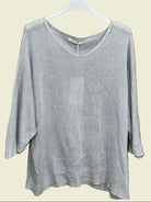 Gray sweater on a hanger