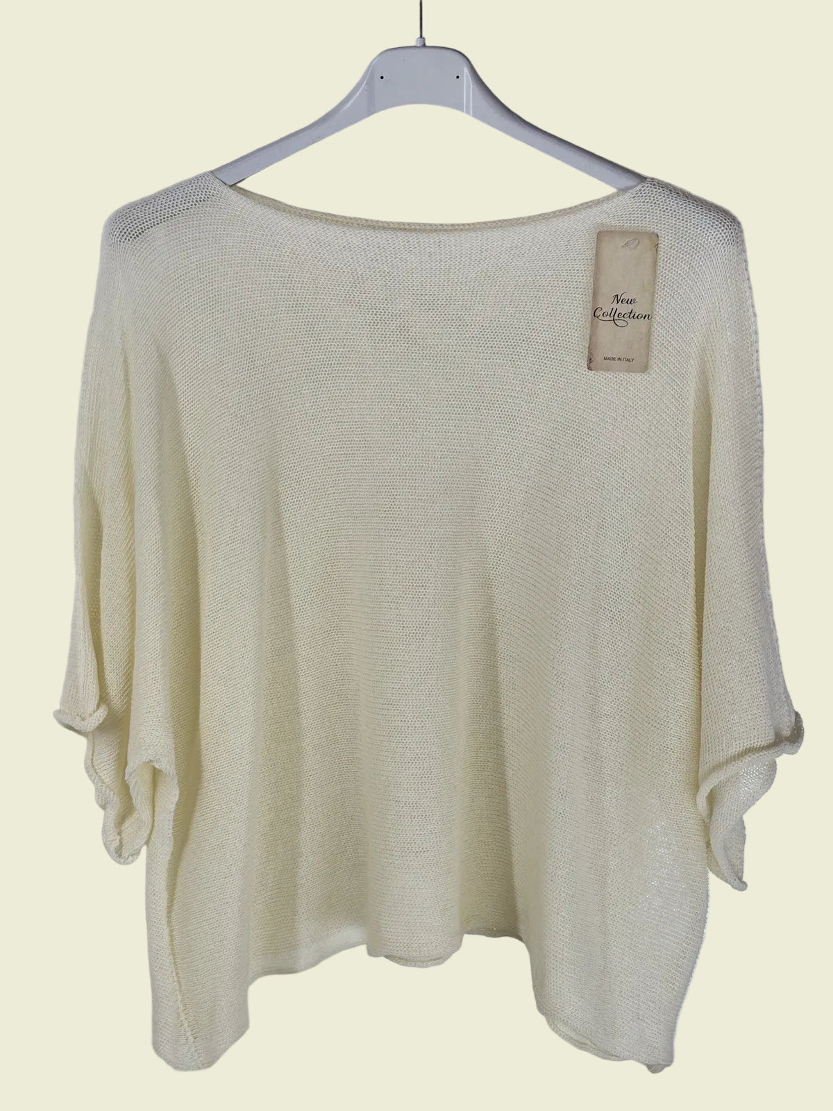 Beige sweater on a hanger 