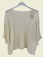 Beige sweater on a hanger 