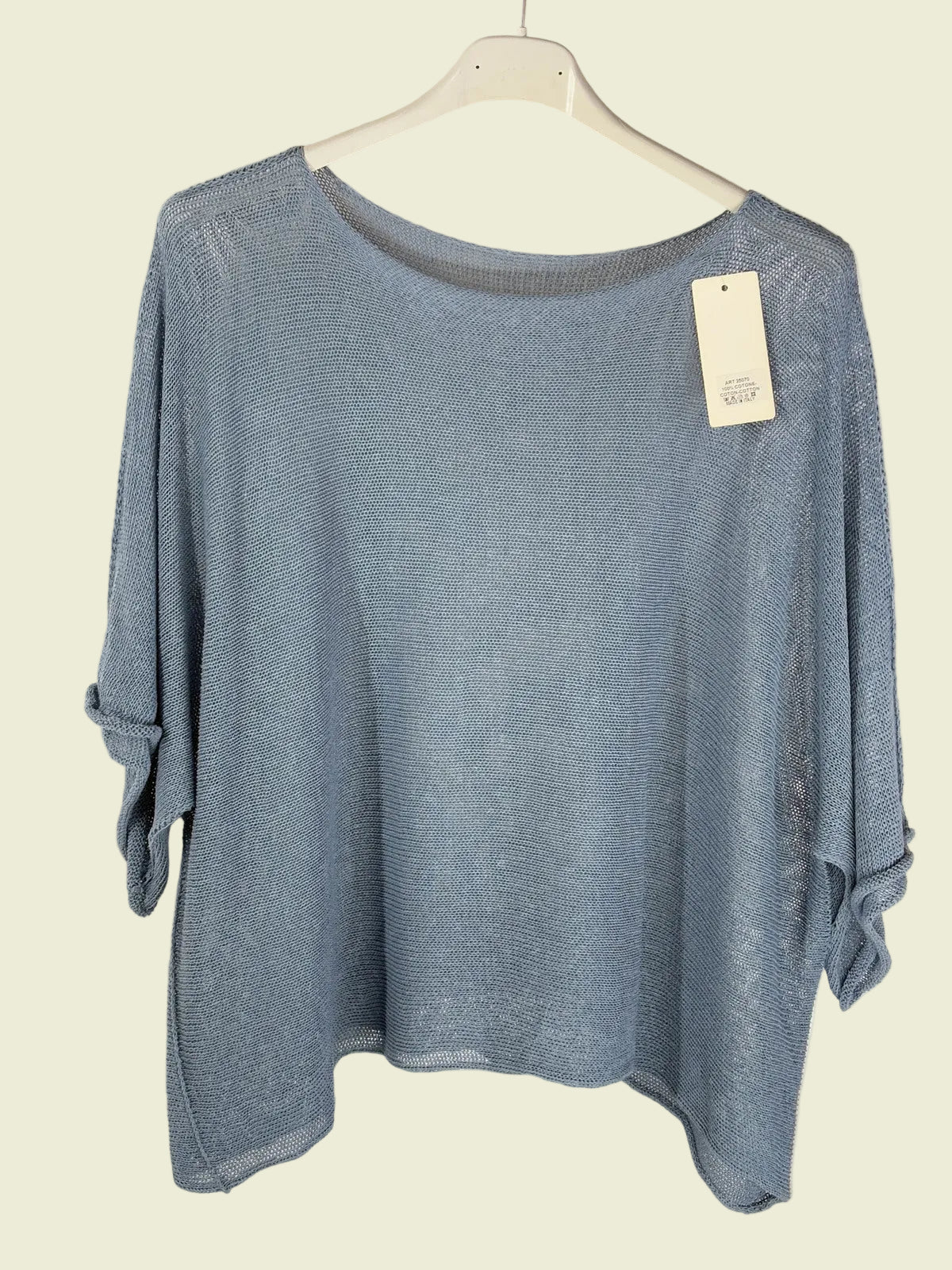 Blue sweater on a hanger 